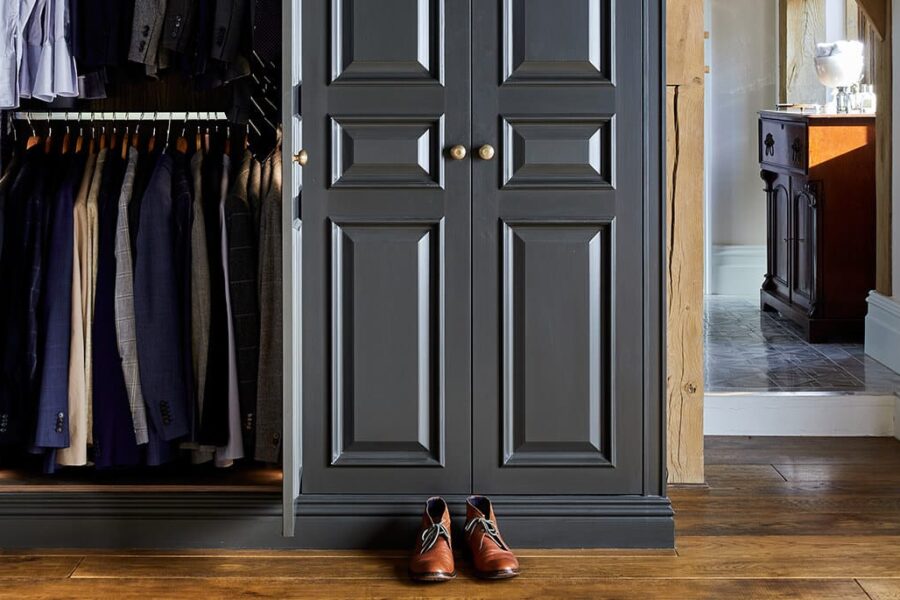 Bespoke dark luxury wardrobe with clothing and shoes