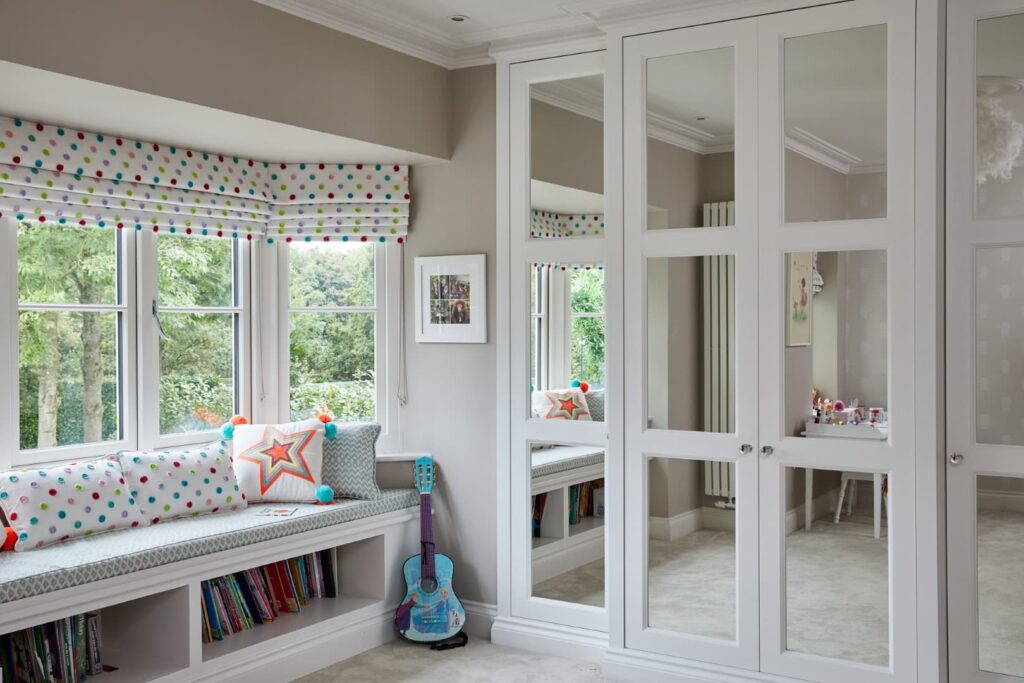 Balmoral fitted wardrobes with mirrored doors i a childs nursery room