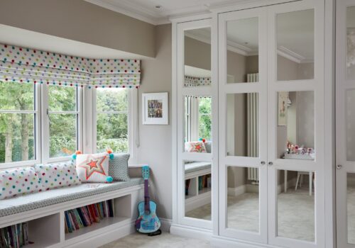 Balmoral fitted wardrobes with mirrored doors i a childs nursery room