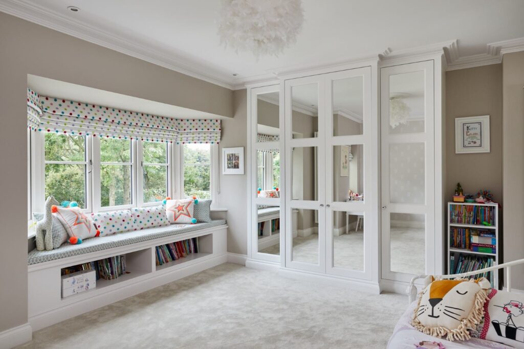 Bespoke Wardrobes Balmoral (1) Bespoke Fitted Wardrobes with mirrored doors and soft seating area below window