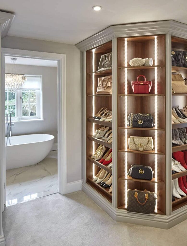 Rebecca Doyle's open walnut shoe and handbag storage.