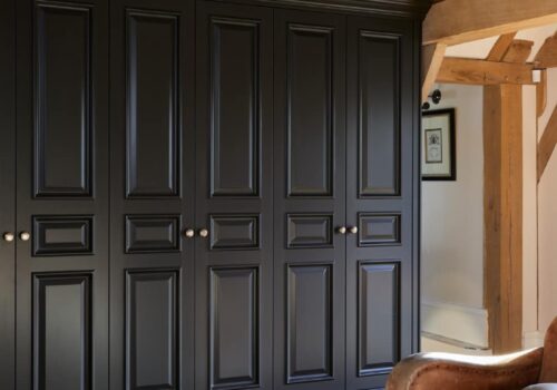 four door Tudor fitted wardrobe in dark blue