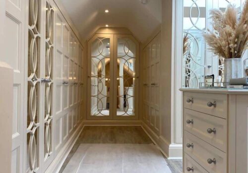 Mirrored doors on a built-in customised wardrobe