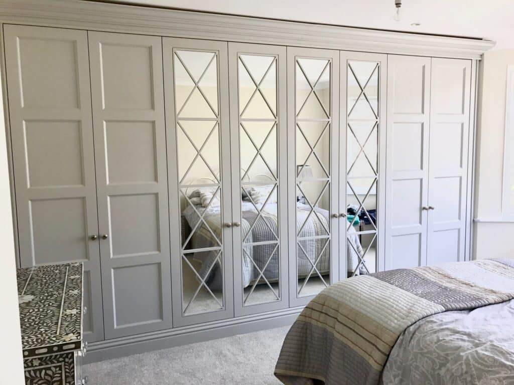 8 Walji Richmond mirrored fitted wardrobes in bedroom in white