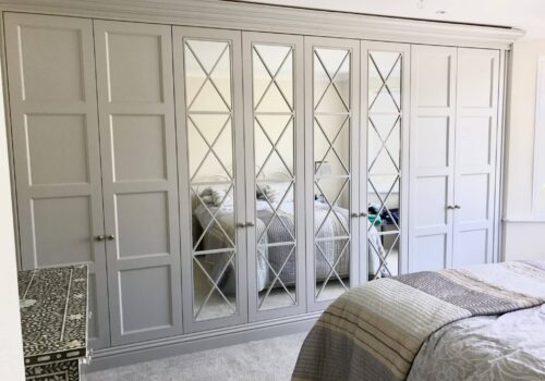 Richmond mirrored fitted wardrobes in bedroom in white