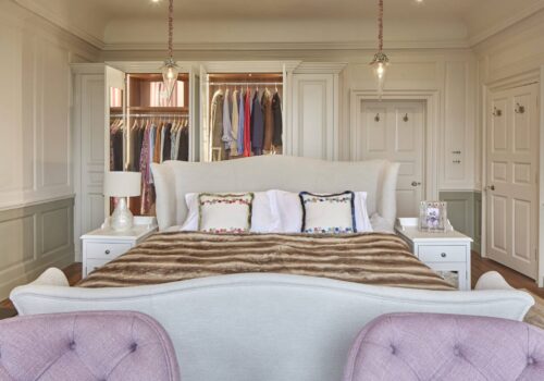 Tudor fitted wardrobe with doors open and internal lighting
