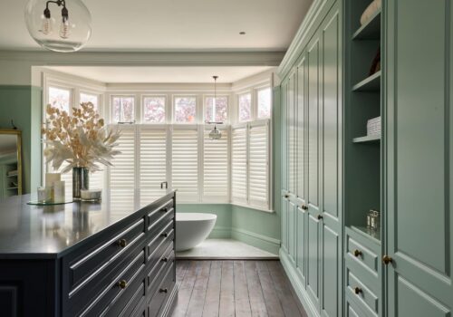 Jubilee fitted wardrobes with island in light green