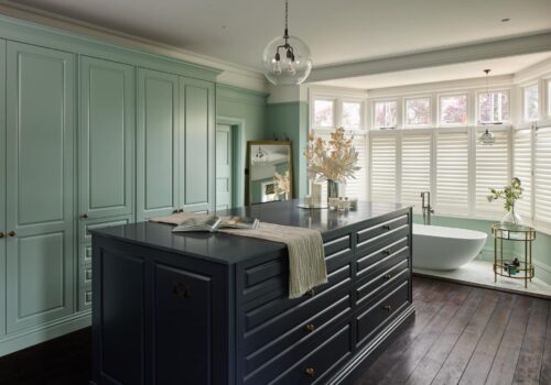 Jubilee fitted wardrobes with blue island in light green