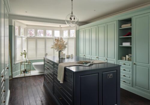 Jubilee fitted wardrobes with blue island in light green