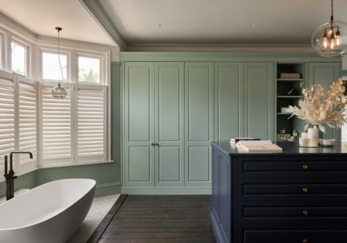 Jubilee fitted wardrobes with island in light green
