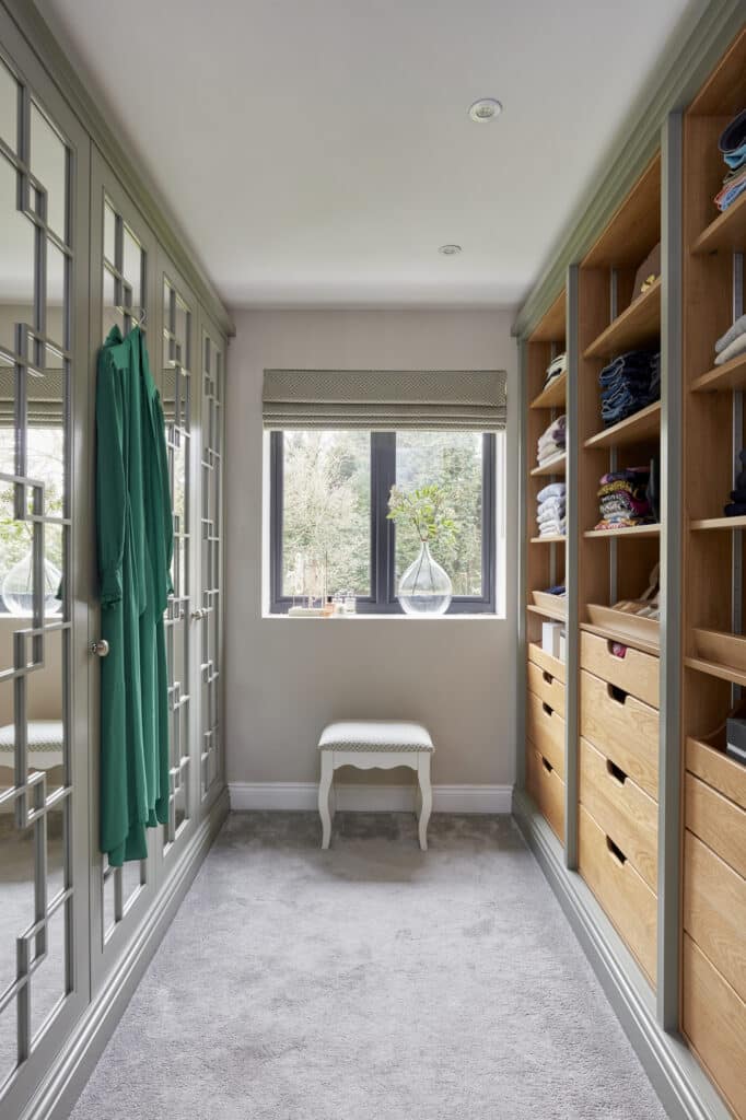 Woking - Wilson 28 White mirrored Wentworth fitted wardrobe with open shelving opposite - lights off