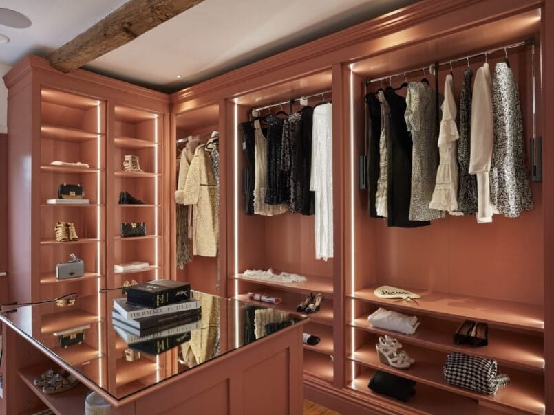 open walk-in wardrobe with LED lighting and an island
