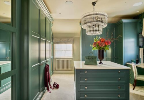 Green, Victorian style dressing room with built-in dressing table and island