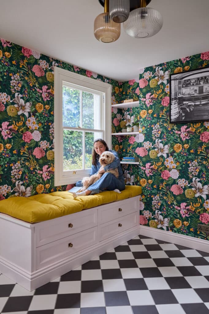 Soft seating area with lady and dog sitting on top