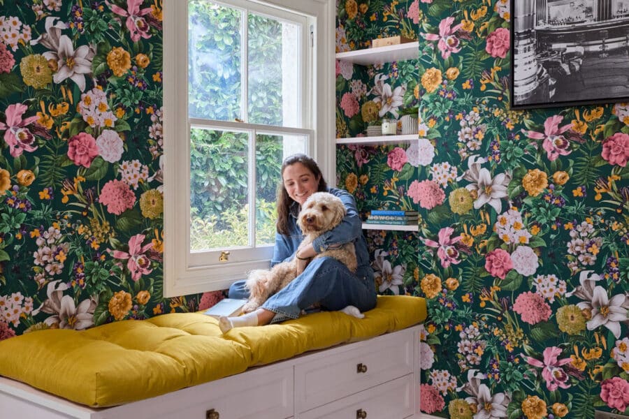 Soft seating area with lady and dog sitting on top