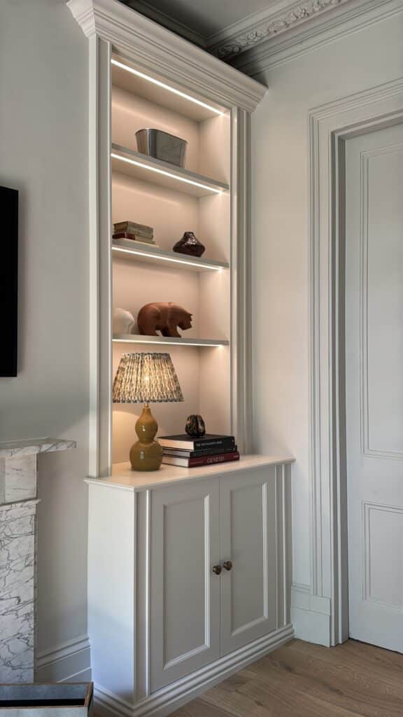 image00031 custom made bookcase built in to an alcove with LED lighting
