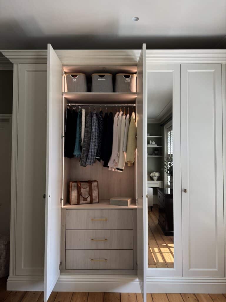 image00053 Fitted wardrobes with doors open and LED lighting