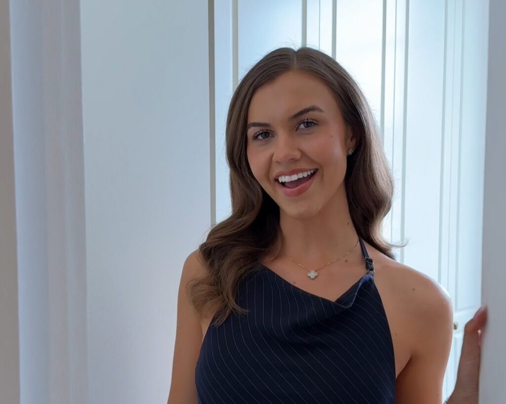 Influencer Isobel Lorna in front of her Tilford Jubilee fitted wardrobe