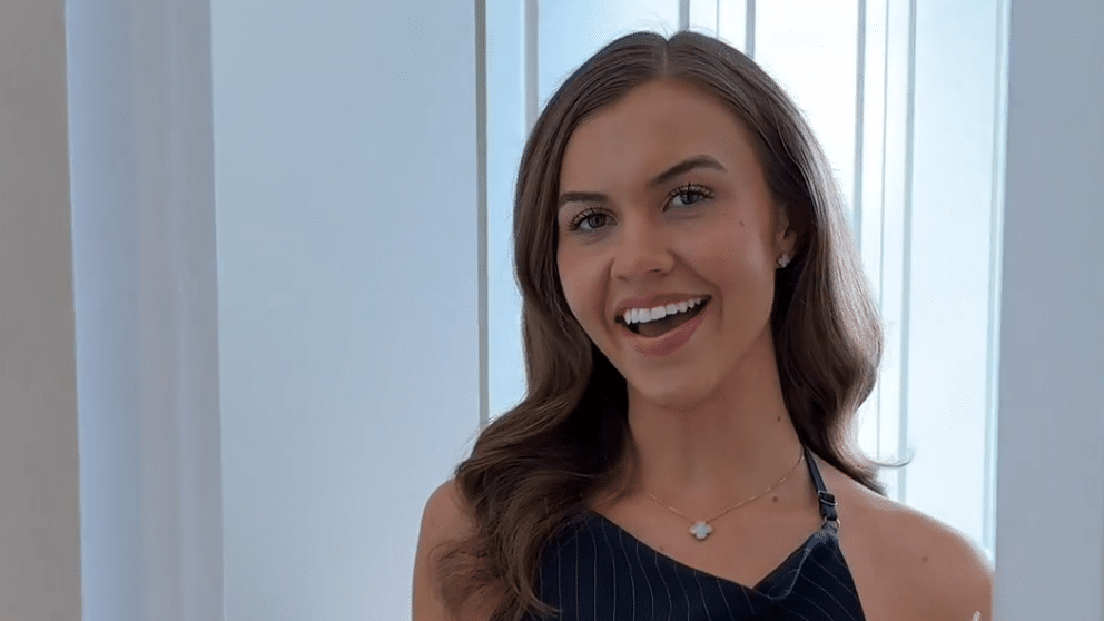 Influencer Isobel Lorna in front of her Tilford Jubilee fitted wardrobe