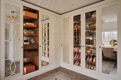 white Balmoral-style corner fitted wardrobe with internal LED lighting