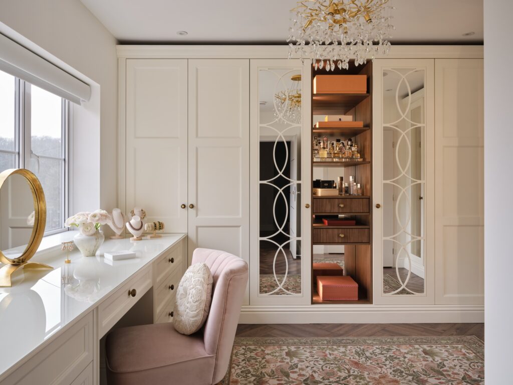 cream fitted wardrobe with bespoke dressing table.